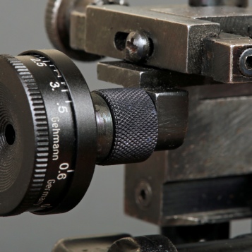 Close up detail of the Custom Gun Parts rearsight adapter on a Wilks rearsight allowin the use of a Gehmann adjustable iris