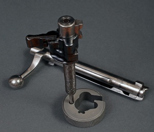 The Custom Gun Parts Mauser M98 bolt tool being used to remove the firing pin from the bolt